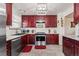 Bright kitchen featuring dark wood cabinets, stainless steel appliances, and ample counter space at 838 S 10Th Ave, Brighton, CO 80601