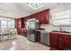 Updated kitchen with stainless steel appliances and ample cabinet space, flowing into dining area at 838 S 10Th Ave, Brighton, CO 80601