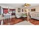 Cozy living room open to the dining area, featuring hardwood floors and comfortable seating at 838 S 10Th Ave, Brighton, CO 80601