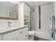 Bathroom features a vanity with granite counters and tub with shower at 3465 S Poplar St # 305, Denver, CO 80224