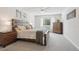 Spacious bedroom with modern ceiling fan and decorative accents that creates a comfortable and inviting atmosphere at 3465 S Poplar St # 305, Denver, CO 80224