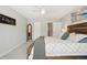 Well-lit bedroom featuring ample space, an artistic ocean view and an attractive full-length mirror at 3465 S Poplar St # 305, Denver, CO 80224