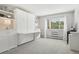 Bedroom features a murphy bed with desk and shelving at 3465 S Poplar St # 305, Denver, CO 80224