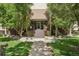 Charming building entrance with a well-kept garden and landscaped walkway to the front door at 3465 S Poplar St # 305, Denver, CO 80224