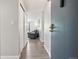 Inviting condo entryway with hardwood floors and a glimpse into the living space at 3465 S Poplar St # 305, Denver, CO 80224