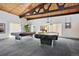 Community game room featuring billiards tables and view of exterior landscaping through bright windows at 3465 S Poplar St # 305, Denver, CO 80224