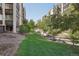 Tranquil outdoor common area with lush greenery and a peaceful waterway, offering a serene natural setting at 3465 S Poplar St # 305, Denver, CO 80224