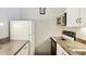 Compact kitchen with white appliances, marble countertops, and ample counter space at 3465 S Poplar St # 305, Denver, CO 80224