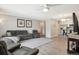 Bright living area with open floor plan, stylish furniture, and views into the kitchen at 3465 S Poplar St # 305, Denver, CO 80224