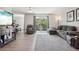 Cozy living room with plush seating, modern flooring, and sliding glass doors to balcony at 3465 S Poplar St # 305, Denver, CO 80224