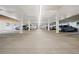 Spacious indoor parking garage offering plenty of room for resident vehicles with overhead lighting at 3465 S Poplar St # 305, Denver, CO 80224