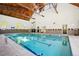 Indoor community pool area with tall wood ceilings, tiled accents, and great natural light at 3465 S Poplar St # 305, Denver, CO 80224