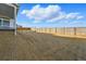 Large backyard with a wooden fence at 16537 Black Rose Cir, Parker, CO 80134
