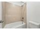 Bathroom features a white bathtub, shower, and toilet at 16537 Black Rose Cir, Parker, CO 80134