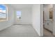Neutral bedroom featuring plush carpeting and a view to other homes in the community at 16537 Black Rose Cir, Parker, CO 80134