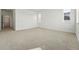 Bright, spacious bedroom featuring neutral carpet, white walls, and windows for natural light at 16537 Black Rose Cir, Parker, CO 80134