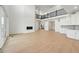 Bright living room with a fireplace, tall ceilings, and wood floors at 16537 Black Rose Cir, Parker, CO 80134
