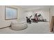 Basement with a comfortable beanbag chair and fitness equipment for a workout area at 6379 Holman Ct, Arvada, CO 80004