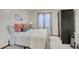 Comfortable bedroom with a plush bed, stylish decor, and a window letting in natural light at 6379 Holman Ct, Arvada, CO 80004