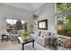 Bright living room with vaulted ceilings, large windows, and comfortable seating arrangement at 6379 Holman Ct, Arvada, CO 80004