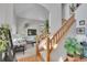 Entryway with staircase leading to the living room, featuring comfortable seating and decor at 6379 Holman Ct, Arvada, CO 80004