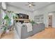 Cozy living room with fireplace, large sectional sofa, and bright natural light at 6379 Holman Ct, Arvada, CO 80004