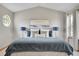 Serene main bedroom with tray ceiling, decorative lamps, and a comfortable bed at 6379 Holman Ct, Arvada, CO 80004