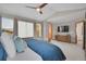 Sun-filled main bedroom with large windows, a ceiling fan, and a modern design at 6379 Holman Ct, Arvada, CO 80004