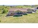 Aerial view of a home with a covered patio and expansive lawn, perfect for outdoor activities at 4959 Rocky View Pt, Castle Rock, CO 80108