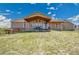 Beautiful home with a covered patio, perfect for outdoor dining and entertaining with backyard at 4959 Rocky View Pt, Castle Rock, CO 80108