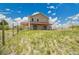 Backyard of home featuring covered patio and open yard area at 4959 Rocky View Pt, Castle Rock, CO 80108