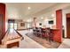 Entertaining basement features bar with granite counters, pool table and shuffleboard for Gathering fun and entertainment at 4959 Rocky View Pt, Castle Rock, CO 80108