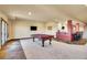 Finished basement with a pool table, bar, and walkout access, perfect for entertaining guests at 4959 Rocky View Pt, Castle Rock, CO 80108