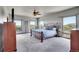 Large primary bedroom with multiple windows providing abundant natural light and scenic views at 4959 Rocky View Pt, Castle Rock, CO 80108