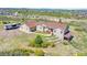 Expansive exterior of home featuring lush green landscape and neutral siding with a recreational vehicle parked on the side at 4959 Rocky View Pt, Castle Rock, CO 80108