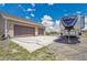 Home with two-car garage and RV parking, boasting a large driveway and well-maintained lawn at 4959 Rocky View Pt, Castle Rock, CO 80108