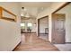 Welcoming hallway featuring wood floors, leading to a bright room with scenic views and an adjacent office space at 4959 Rocky View Pt, Castle Rock, CO 80108