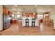 Spacious kitchen with stainless steel appliances, wood cabinets, and a central island with bar seating at 4959 Rocky View Pt, Castle Rock, CO 80108