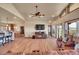 Spacious living room with an open floor plan featuring wood floors, kitchen, dining area, and scenic views at 4959 Rocky View Pt, Castle Rock, CO 80108