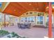 Home with patio area, featuring a dining table, chairs, large windows and sliding doors to backyard at 4959 Rocky View Pt, Castle Rock, CO 80108