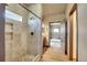 Contemporary tiled walk-in shower with a rainfall shower head and built-in niche for toiletries at 4959 Rocky View Pt, Castle Rock, CO 80108
