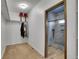 Organized walk-in closet leading to a luxurious tiled shower with a small window at 4959 Rocky View Pt, Castle Rock, CO 80108