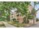 Charming brick building with green awnings and well-maintained landscaping at 2100 N Franklin St # 20, Denver, CO 80205