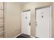 Hallway featuring the front doors to units 19 and 20 with a black welcome mat at the doorway at 2100 N Franklin St # 20, Denver, CO 80205
