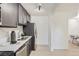 Modern kitchen featuring stainless steel appliances, gray cabinets and quartz countertops at 2100 N Franklin St # 20, Denver, CO 80205