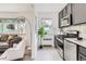 Stylish kitchen featuring stainless steel appliances and cozy living area with comfortable seating at 2100 N Franklin St # 20, Denver, CO 80205