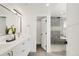 Modern bathroom featuring double vanity, and a glass-enclosed shower at 4201 Vallejo St, Denver, CO 80211