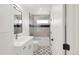 A bathroom with tile floors, white cabinets, and a shower with glass doors providing a comfortable and functional space at 4201 Vallejo St, Denver, CO 80211