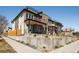 Modern house with a rooftop deck, clean lines, and manicured landscaping showcasing the property's exterior at 4201 Vallejo St, Denver, CO 80211