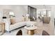 Open concept living area with sleek furnishings and abundant natural light at 4201 Vallejo St, Denver, CO 80211
